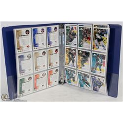 BINDER OF ASSORTED HOCKEY CARDS.