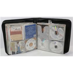 BINDER WITH 12 PAGES OF CD'S