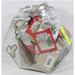 LARGE COOKIE JAR FULL OF DIFFERENT ITEMS