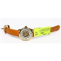 SKELETON FACED GOLD AND WHITE TONED WATCH WITH