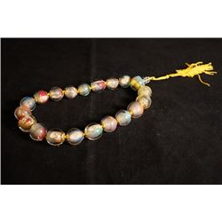 An Inside-Painted Glass "Eighteen Arhats" Hanging Decoration.