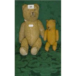 Teddy bear circa 1950 with glass eyes and stitched nose plus a smaller older bear with metal jointed