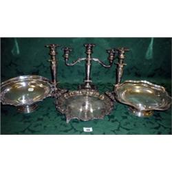 Silver plated candelabra plus two matching candlesticks and three plated trays