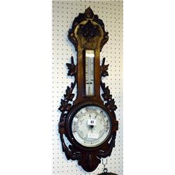 Ornate oak banjo aneroid barometer with carved vines to top and sides