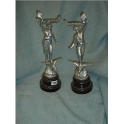 Pair of spelter menu holders in the form of classical figures on outstretched birds' wings