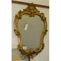 Ornate gilded, framed toilet mirror