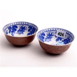 Pair of 19c Chinese blue & white bowls decorated with stylised Carp, chocolate lustre glaze to exter