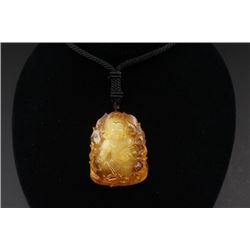 Amber Carved Avalokitesvara (Guan Yin) Pendant.