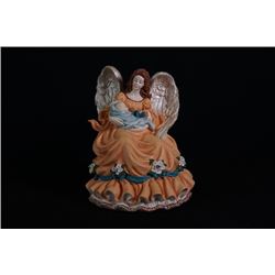 A "Guardian Angel" Porcelain Figurine.