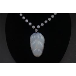 A Deep Sea Agate Carved "Leaf" Pendant with Necklace.