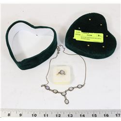 ART DECO SILVER HAND HOLDING MOONSTONE RING