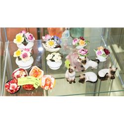SHELF OF CHINA FLOWERS, SIAMESE CATS AND PAPER