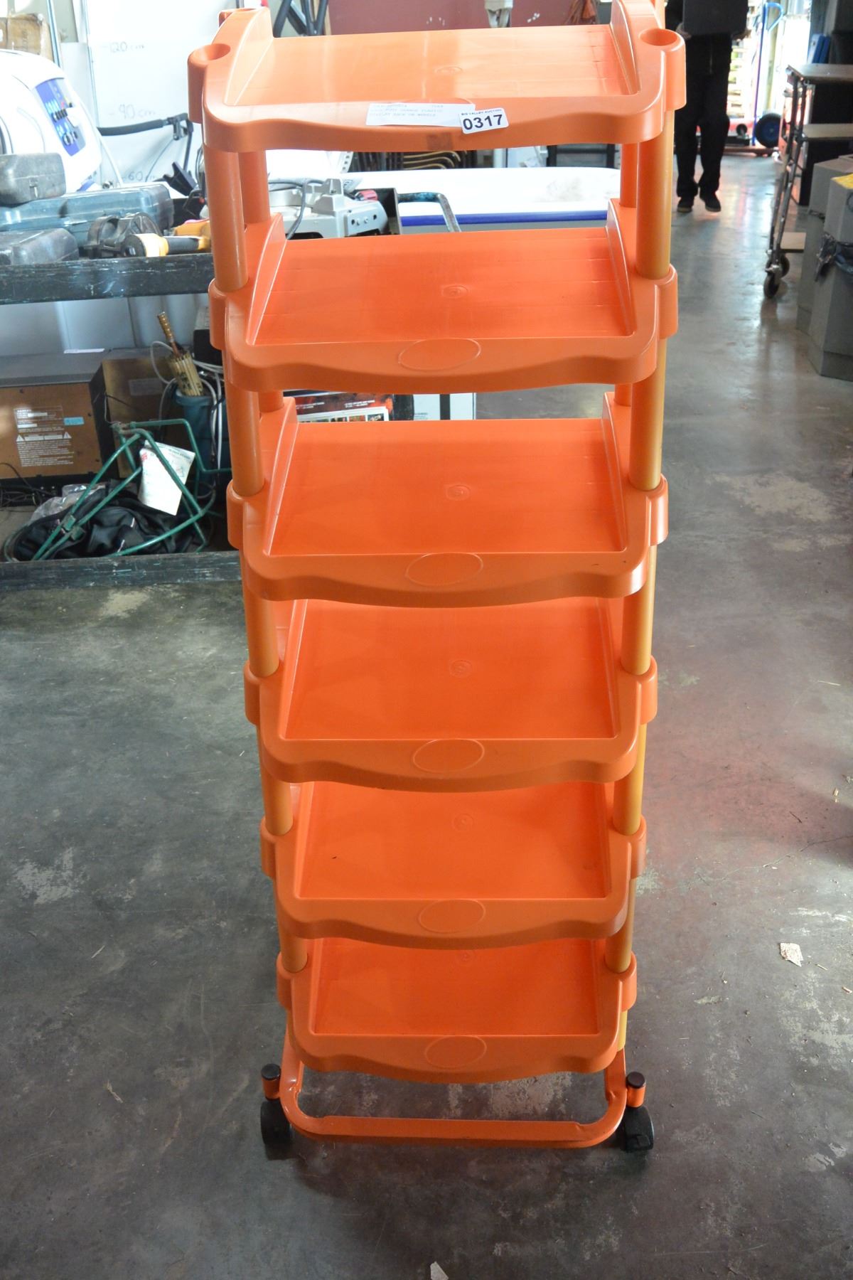 FOUR FOOT ORANGE PLASTIC DISPLAY RACK ON WHEELS