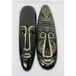 TWO WOODEN CARVED TRIBAL MASKS.