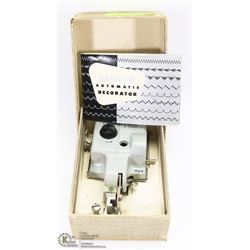 VINTAGE WHITE AUTOMATIC DECORATOR