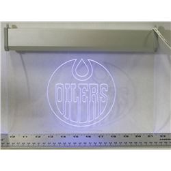 HANGING OILERS  LIGHT UP SIGN.