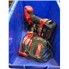 Image 1 : Milwaukee M18 drill, M12 drivers M12 light & charging station