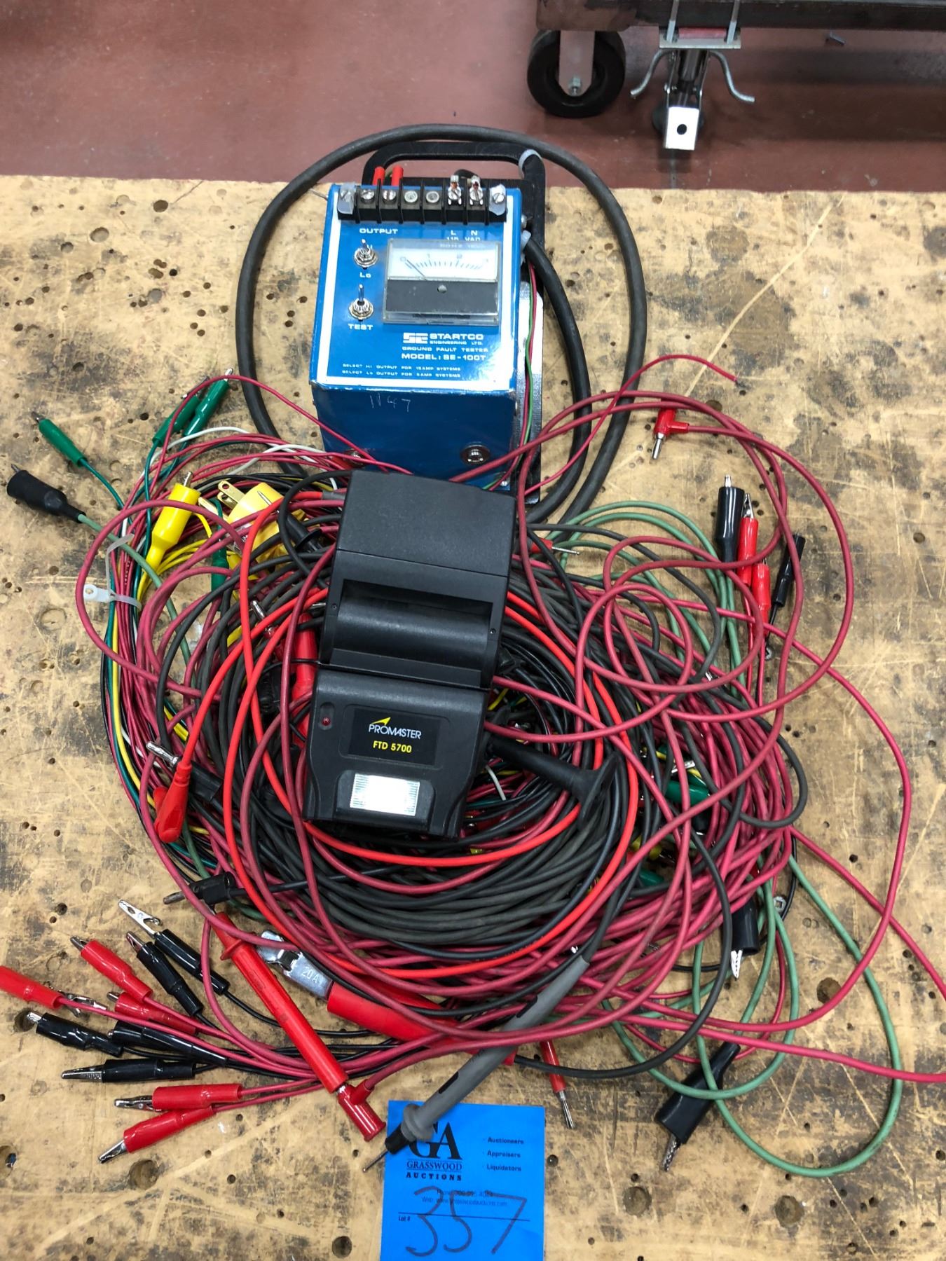 Assorted test leads, camera flash, ground fault tester