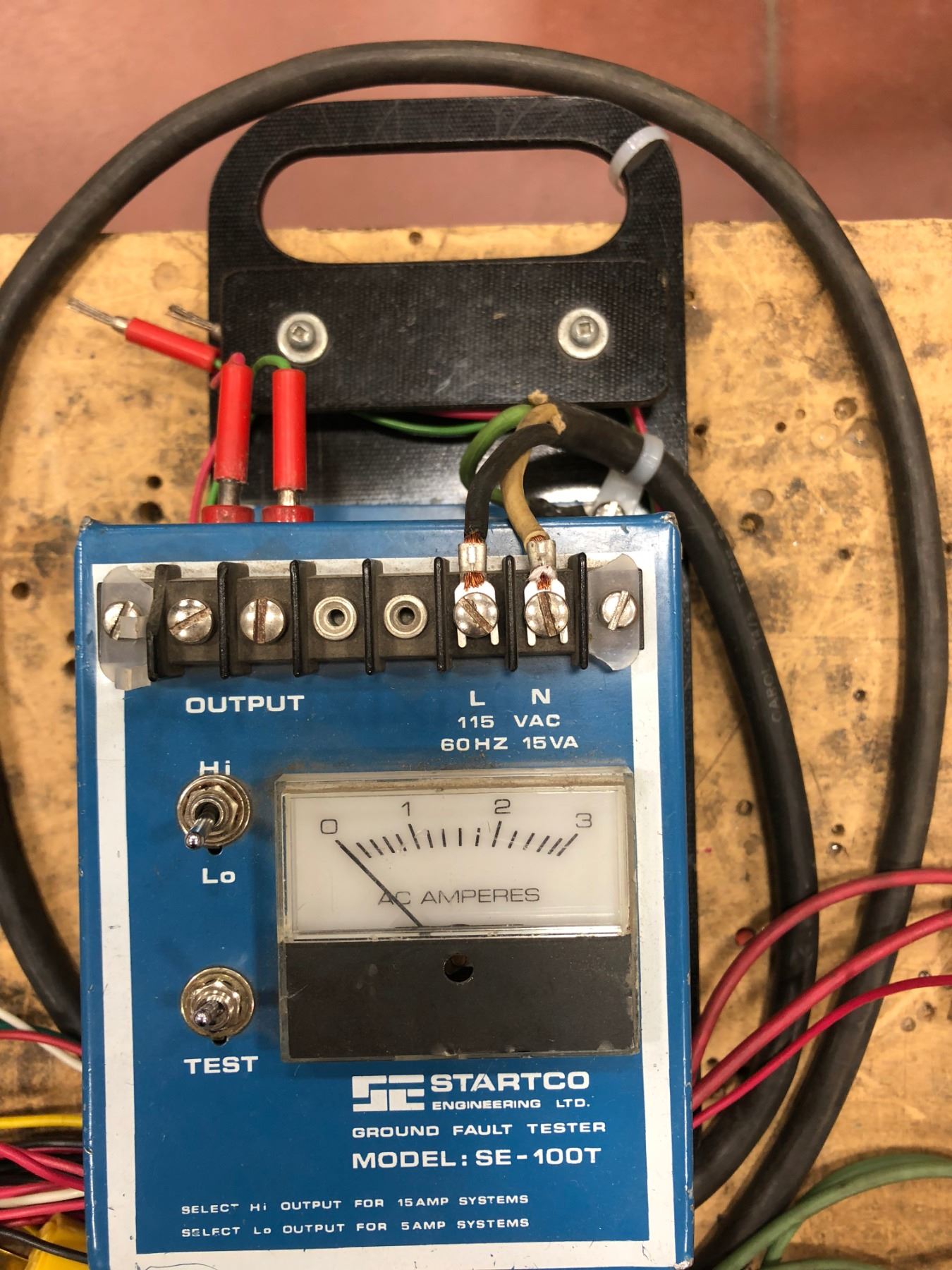 Assorted test leads, camera flash, ground fault tester