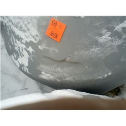 100 bushel poly tank with slight damage in one corner