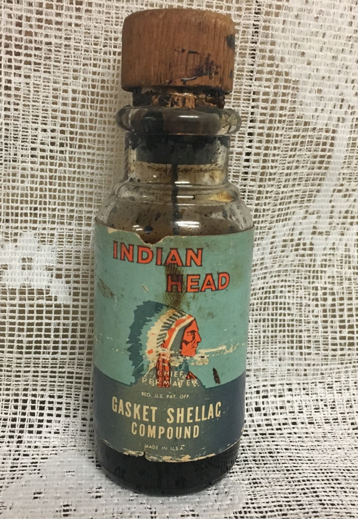 INDIAN HEAD, GASKET SHELLAC COMPOUND, 2 OZ GLASS BOTTLE