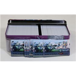 TIN OF ASSORTED RACE CAR COLLECTOR CARD TAGGZ