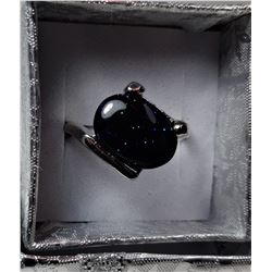 20)  BLACK OVAL GOLDSTONE  RING