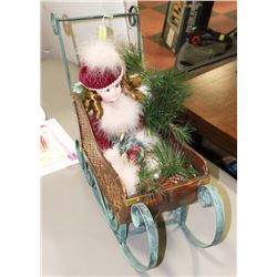 CHRISTMAS SLEIGH WITH DOLL IN IT.