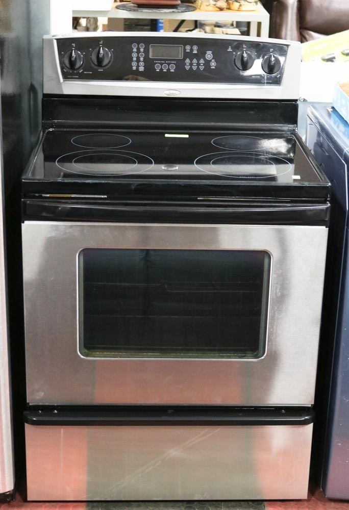 WHIRLPOOL BLACK AND STAINLESS STEEL FLAT TOP RANGE