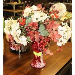 BURGUNDY VASE WITH ARTIFICIAL FLOWERS.