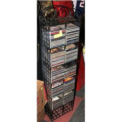 CD RACK WITH OVER 100 CDS