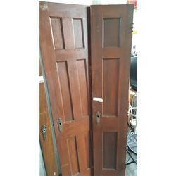 PAIR OF ECENTRIC ANTIQUE PANNELLED PASSAGE DOORS