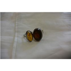2 SILVER AND AMBER RINGS