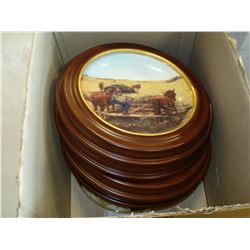 BOX OF COLLECTOR PLATES IN WOOD HOLDERS FROM WANBURG MINT