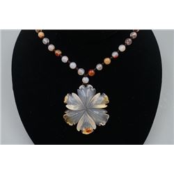 A Deep Sea Agate "Floral" Pendant with Bead Necklace.