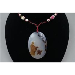 A Deep Sea Agate Oval Pendant with Bead Necklace.