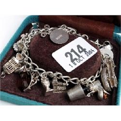 Silver stamped charm bracelet with various charms