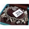 Image 1 : Silver stamped charm bracelet with various charms