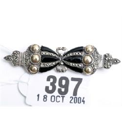 Onyx and marquisette bow brooch in silver