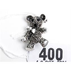 Silver brooch in form of teddy set with marquisette and onyx