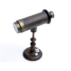 Late 19c kaleidoscope unsigned with glass specimen particles, raised on baluster turned column and p