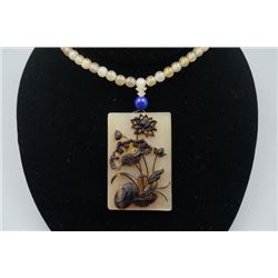 An Antelope's Horn "Lotus" Pendant with Beads Necklace.