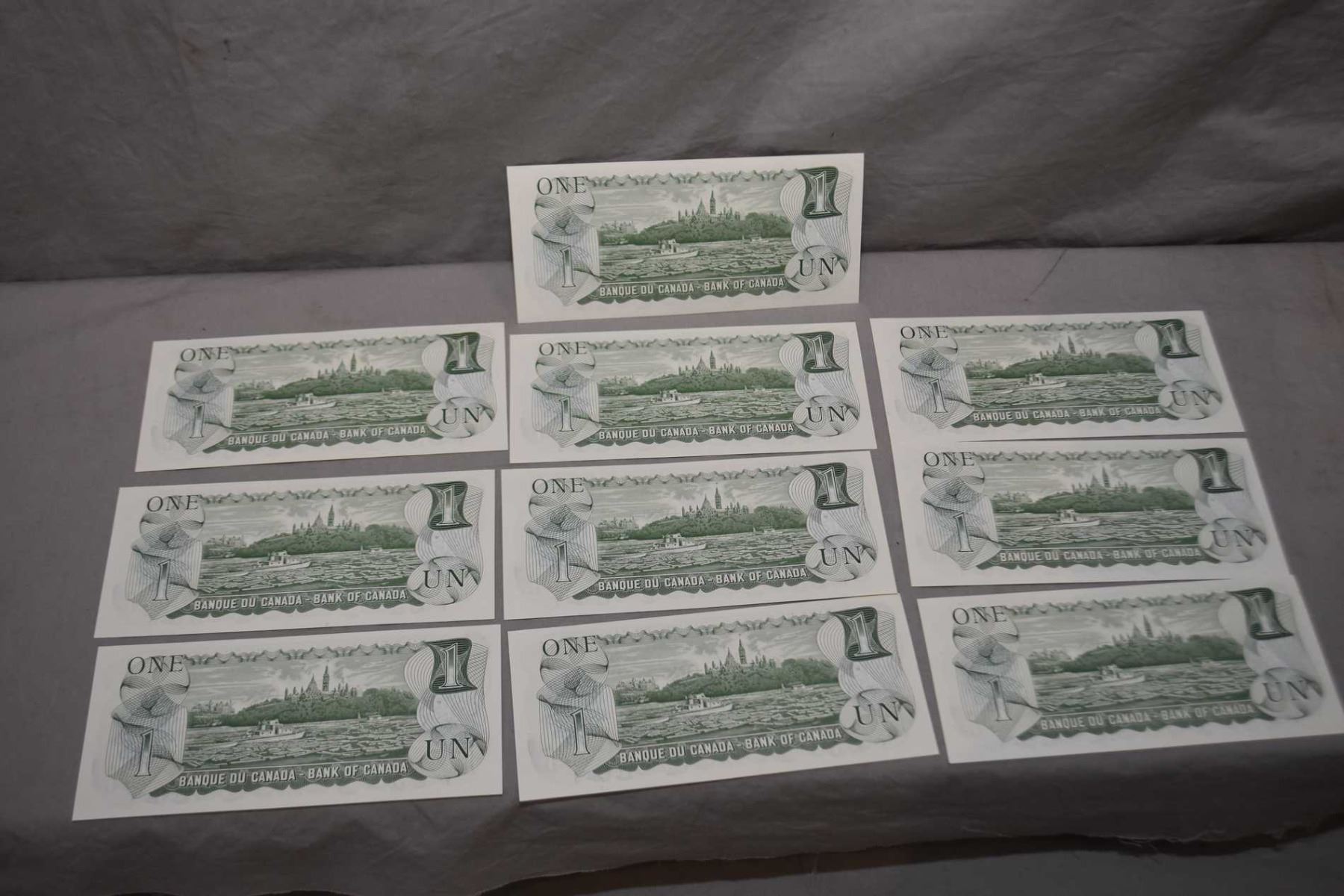 Ten noncirculated 1973 Canadian one dollar bills with sequential serial numbers Ten noncirculated 1973 Canadian one dollar bills with sequential serial numbers