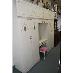 Painted French style fitted wardrobe unit including double wardrobes, top storage surrounding a mirr