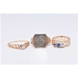 Three ladies gold rings including 14kt yellow gold and solitaire diamond ring, 14kt white and yellow