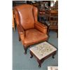 Image 1 : Vintage well worn tanned leather wing back chair with cabriole supports a vintage needlepoint uphols