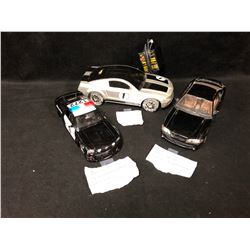 TOY CAR LOT (1994 DIE-CAST MUSTANG/ HOT WHEELS MUSTANG GT BATTERY OPERATED/ 2006 MUSTANG COP CAR)