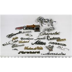 BUCKET OF ASSORTED VINTAGE VEHICLE EMBLEMS