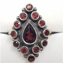 65) STERLING SILVER GARNET RING SIZE 7