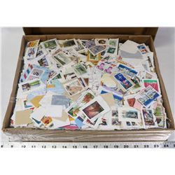 LARGE BOX OF 4.5LBS OF POSTAGE STAMPS